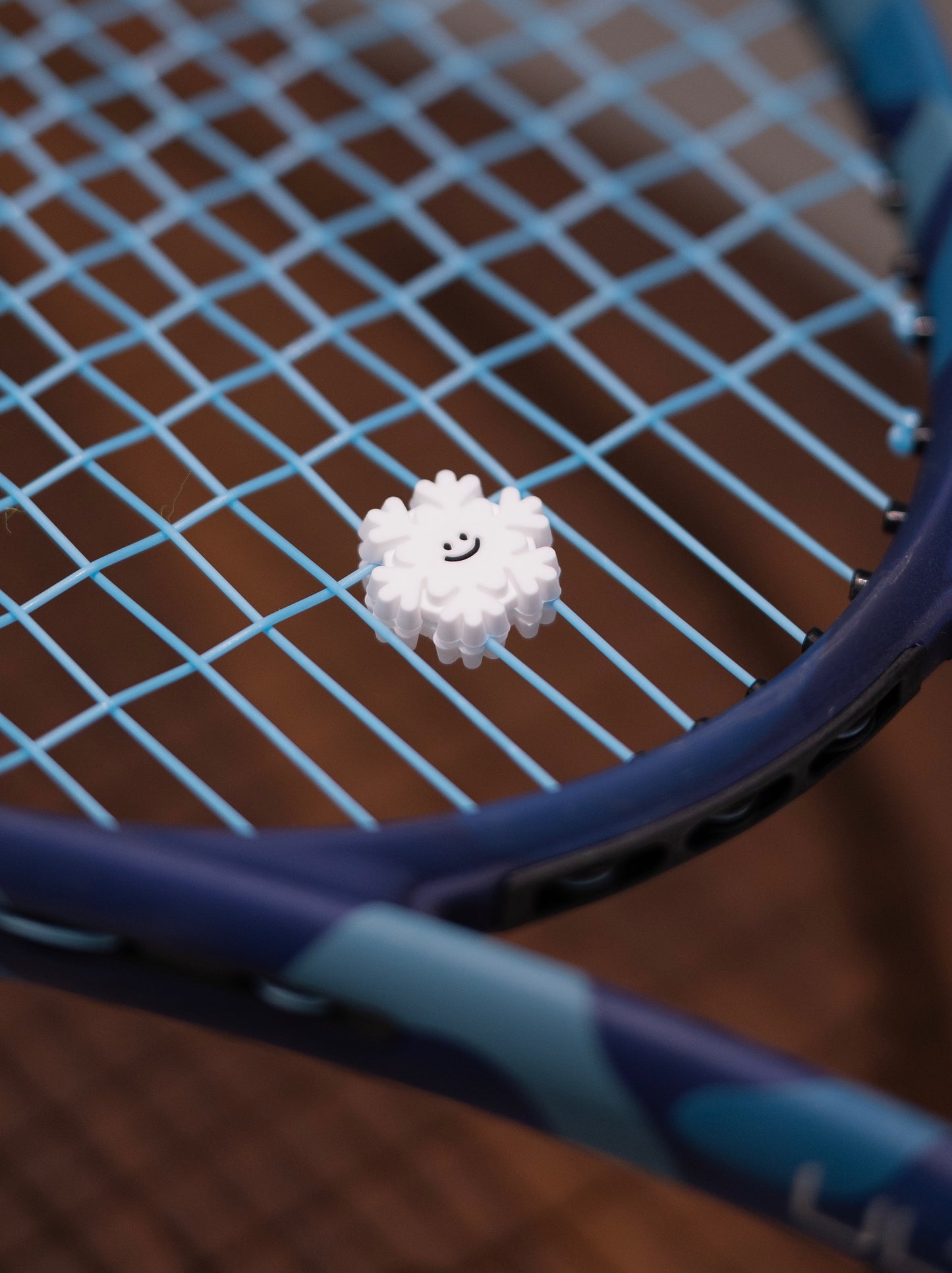 Playful Snow Tennis Racket Dampener - Weather the Game with a Smile