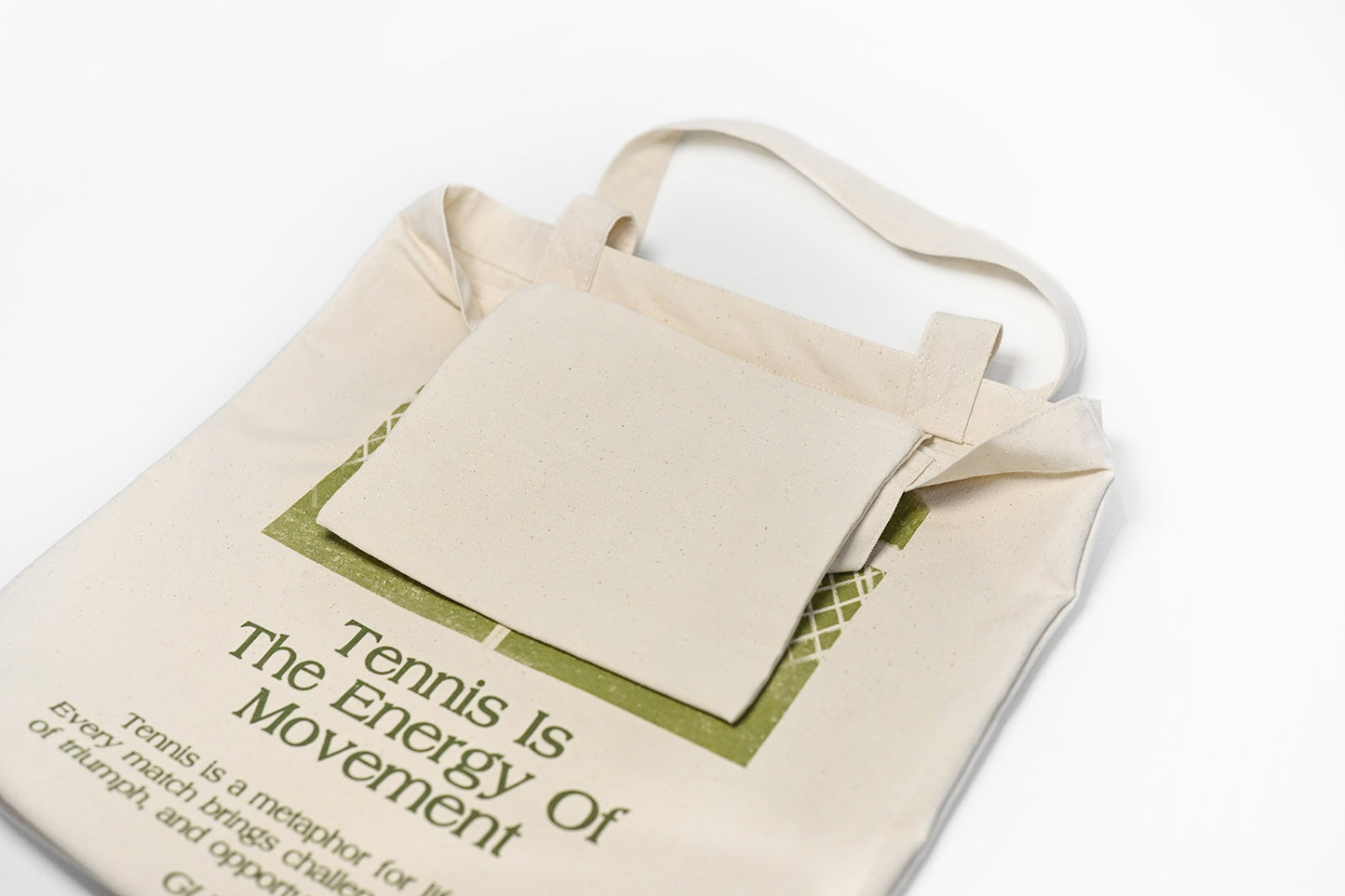 Inner pocket detail of tennis canvas tote bag, ideal for storing keys, phone, and small items