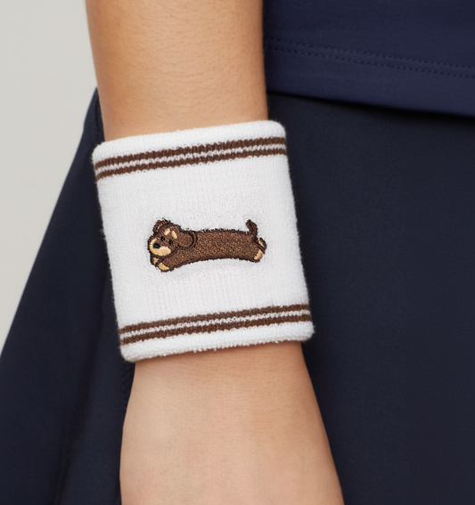 White cotton wristband with embroidered dachshund dog design, terry texture