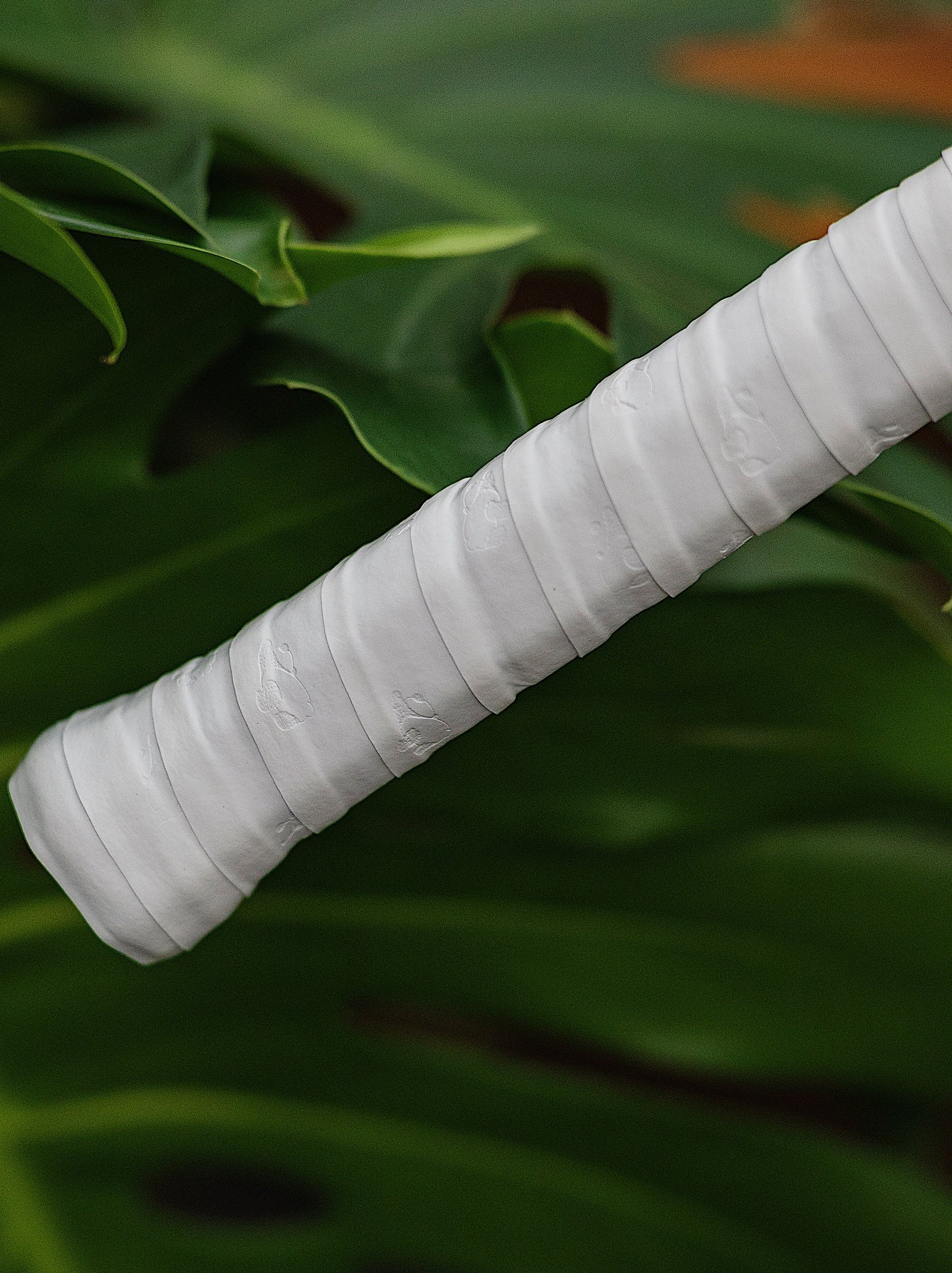 Close-up of Panda Tennis Overgrip Texture – PU Sticky Surface with Panda Pattern