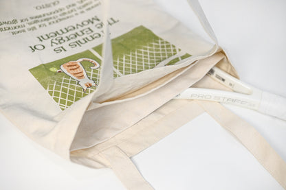 Main divider detail of tennis canvas tote bag, showing compartment for separating tennis racket and other items
